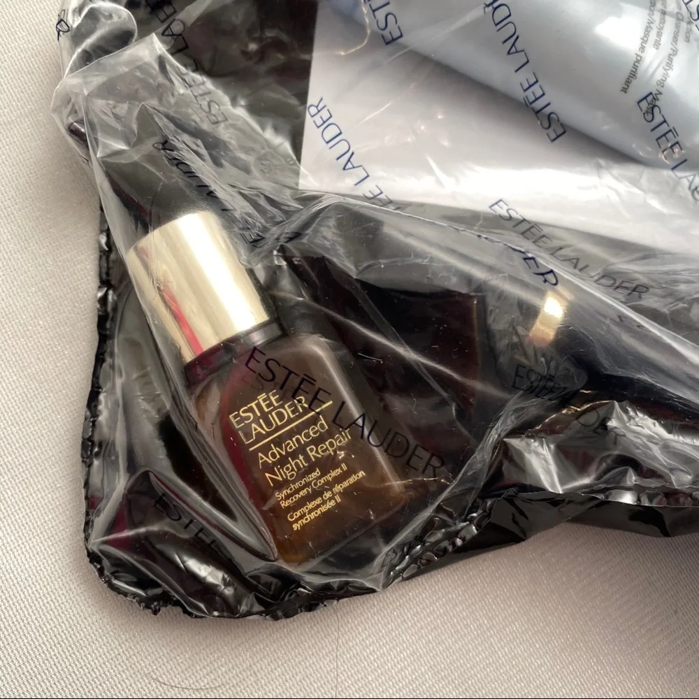 Estée Lauder bag, lipstick, night repair, cleanser